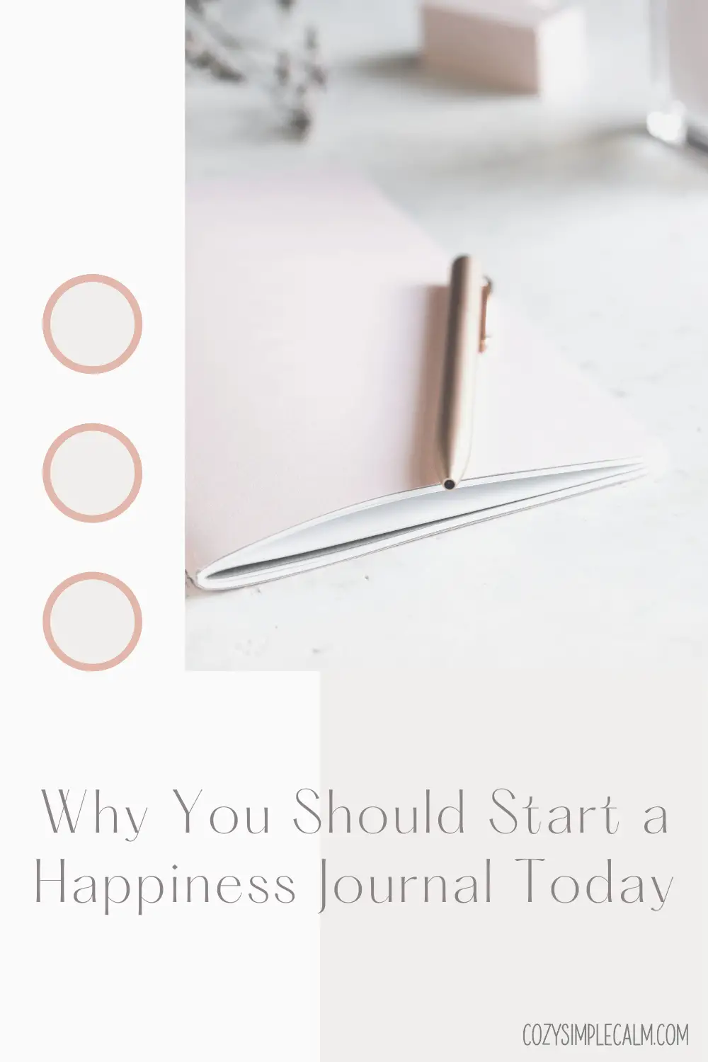 Image of gold pen sitting on top of pink notebook - Text overlay: Why you should start a happiness journal today